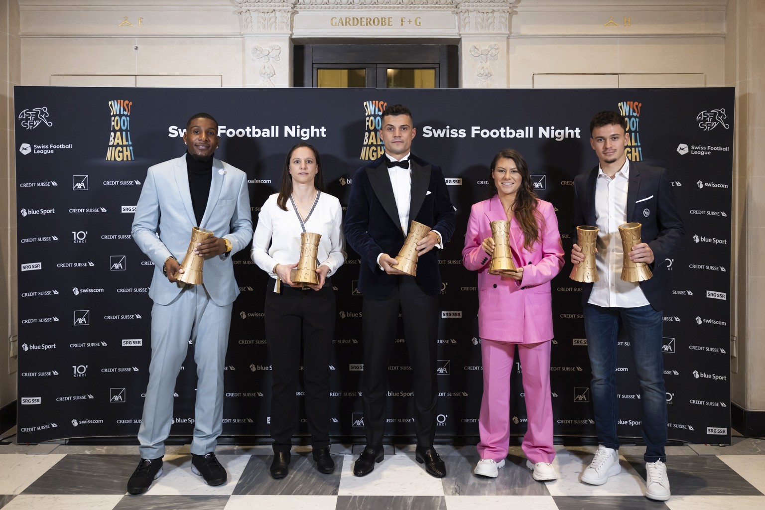 epa10425342 The winners at the Swiss Football Night 2022, from left, Brighton Labeau (challenge league player), Fabienne Humm (women&#039;s super league player), Granit Xhaka (male national player), R ...