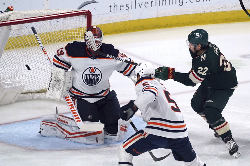 Minnesota Wild&#039;s Kevin Fiala (22) watches his shot go wide past Edmonton Oilers goalie Mikko Koskinen during the first period of an NHL hockey game Tuesday, April 12, 2022, in St. Paul, Minn. (AP ...