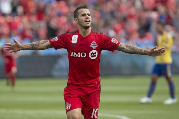 FILE - In this Sept. 19, 2015, file photo, Toronto FC&#039;s Sebastian Giovinco celebrates after scoring his team&#039;s second goal against the Colorado Rapids during the first half of the MLS soccer ...