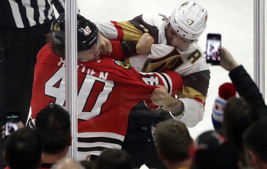 Chicago Blackhawks right wing John Hayden, left, and Vegas Golden Knights defenseman Luca Sbisa fight during the second period of an NHL hockey game Friday, Jan. 5, 2018, in Chicago. (AP Photo/Nam Y.  ...