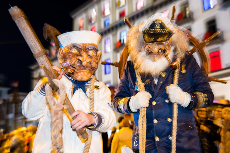 epa11940725 Masked brass and percussion carnival bands parade through the streets during the Monstercorso, the grand finale of the carnival, on Shrove Tuesday in Lucerne, Switzerland, 04 March 2025. E ...