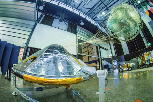 A full-size model of the European ExoMars entry, descent and landing module, Schiaparelli, with its parachute deployed revealed on ESAÕs open day on October 4, 2016 in the Netherlands. ESAÐS. Muirhead ...