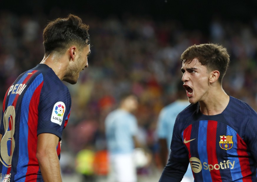 Barcelona&#039;s Pedri, left, celebrates with Barcelona&#039;s Gavi after scoring his side&#039;s opening goal during a Spanish La Liga soccer match between FC Barcelona and Celta Vigo at Camp Nou sta ...