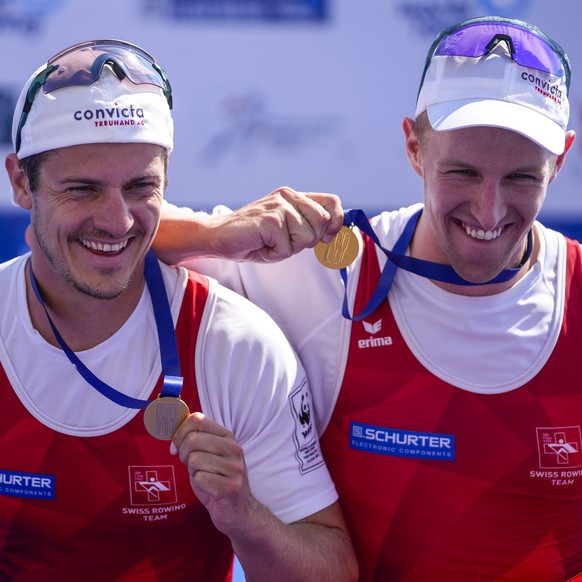 Race winners Roman Roeoesli and Andrin Gulich of Switzerland celebrate after the Men's Pair Final A at the World Rowing Championships in Belgrade, Serbia, Saturday, Sept. 9, 2023. (AP Photo/Darko ...