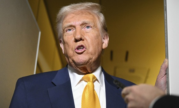President Donald Trump speaks to the reporters on board Air Force One on the way to Miami, Saturday, April 12, 2025. (Pool via AP)
Trump