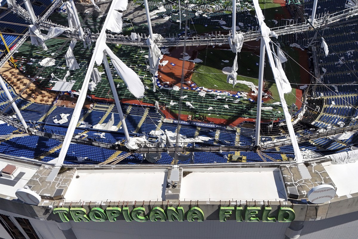 The roof of the Tropicana Field is damaged the morning after Hurricane Milton hit the region, Thursday, Oct. 10, 2024, in St. Petersburg, Fla. (AP Photo/Mike Carlson)