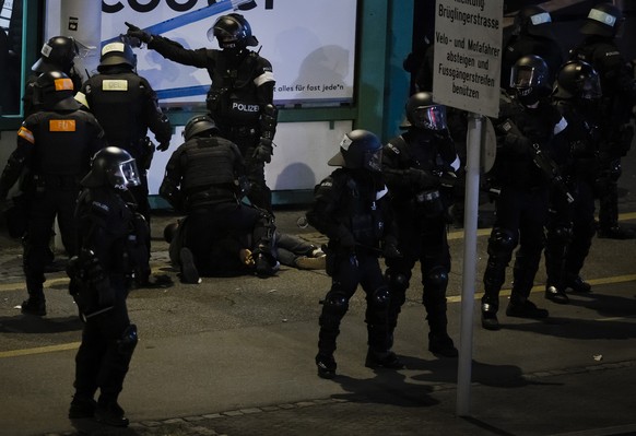 Police officers arrest a football fan after the UEFA Conference League round of 16 second leg soccer match between Switzerland&#039;s FC Basel 1893 and France&#039;s Olympique de Marseille in front of ...