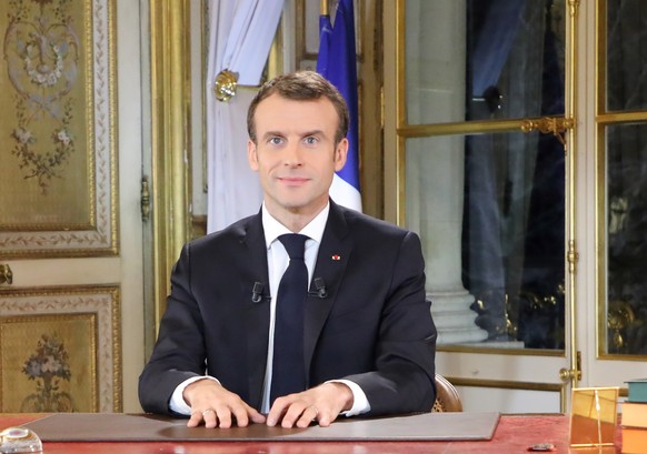 epa07222306 French President Emmanuel Macron speaks during a special address to the nation, his first public comments after four weeks of nationwide &#039;yellow vest&#039; (gilet jaune) protests, at  ...