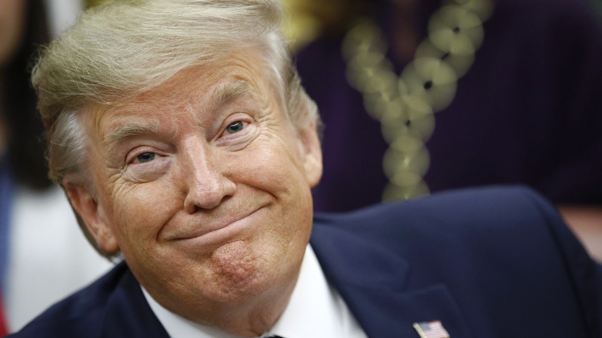 President Donald Trump participates in a bill signing ceremony for the Women's Suffrage Centennial Commemorative Coin Act in the Oval Office of the White House, Monday, Nov. 25, 2019, in Washingt ...