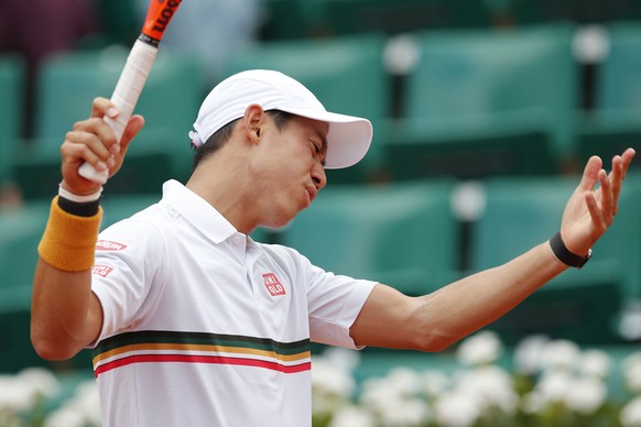 Japan&#039;s Kei Nishikori reacts as he plays Spain&#039;s Fernando Verdasco during their fourth round match of the French Open tennis tournament at the Roland Garros stadium, Monday, June 5, 2017 in  ...
