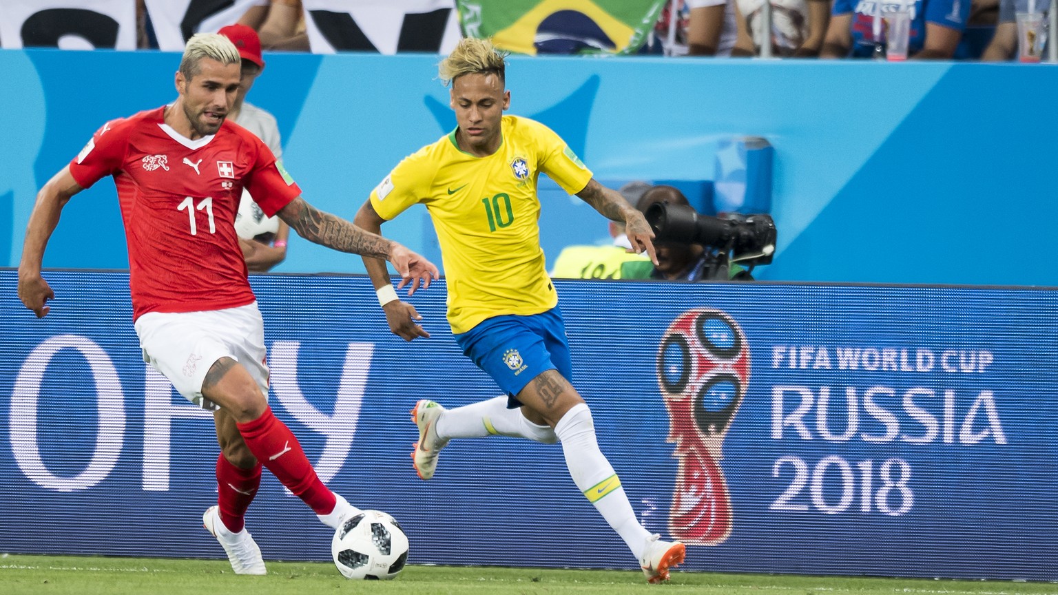 Switzerland&#039;s midfielder Valon Behrami, left, fights for the ball against Brazil&#039;s forward Neymar, right, during the FIFA soccer World Cup 2018 group E match between Switzerland and Brazil a ...