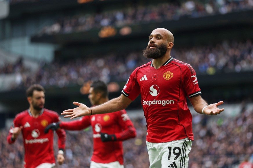 Manchester United's Bryan Mbeumo celebrates after scoring his side's opening goal during the English Premier League soccer match between Tottenham Hotspur and Manchester United in London, En ...