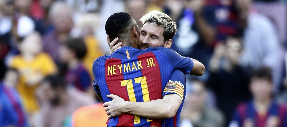 FC Barcelona's Lionel Messi, right, celebrates after scoring with his teammate Neymar during the Spanish La Liga soccer match between FC Barcelona and Deportivo Coruna at the Camp Nou in Barcelon ...