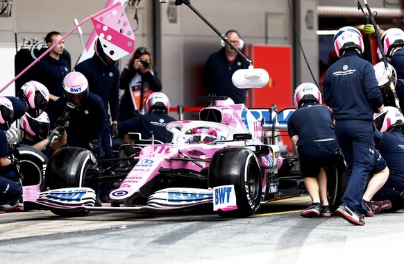 Pit crew work on the car of Racing Point driver Sergio Perez of Mexico during the Formula One pre-season testing session at the Barcelona Catalunya racetrack in Montmelo, outside Barcelona, Spain, Fri ...