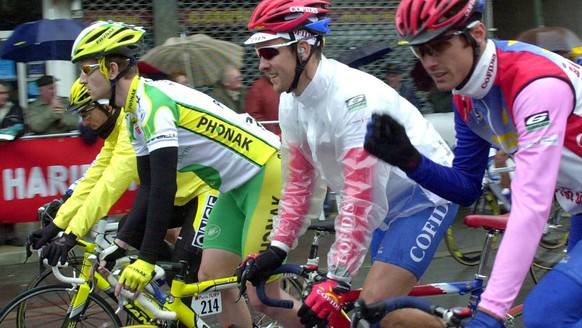 Switzerland&#039;s Jean Nuttli, second left (Phonak), Belgium&#039;s Nico Mattan, center, and Scotland&#039;s David Millar pedal at the start of the Paris-Nice cycling race first stage, Monday March 1 ...