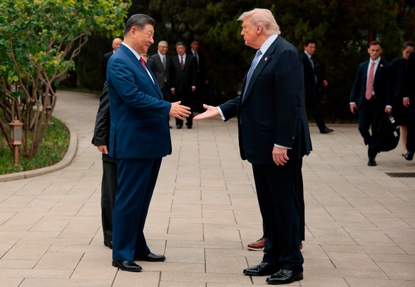 U.S. President Donald Trump, right, shakes hands with Chinese President Xi Jinping while leaving after a visit to the Zhongnanhai Garden in Beijing, Friday, May 15, 2026. (Evan Vucci/Pool Photo via AP ...