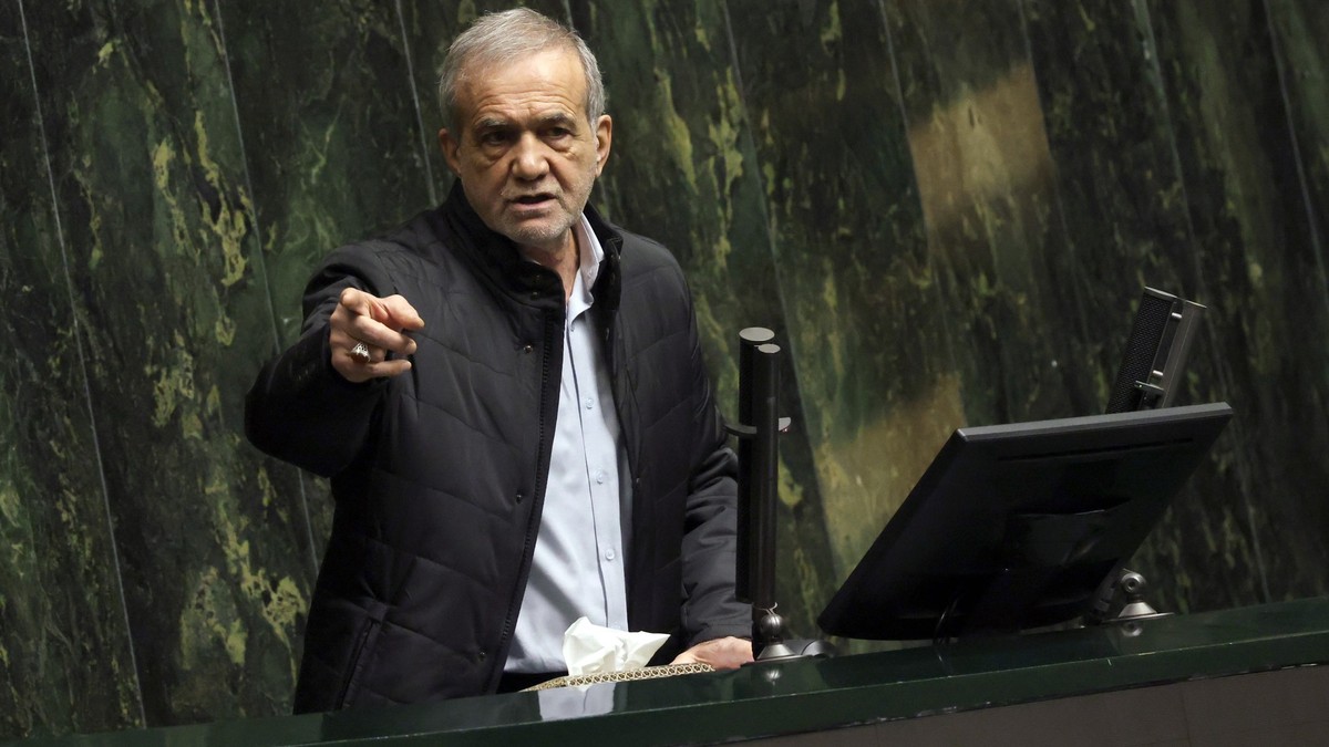 epa11934141 Iranian President Masoud Pezeshkian speaks during a Parliament session to defend his Minister of Economy and Finance at the Iranian Parliament in Tehran, Iran, 02 March 2025. According to  ...