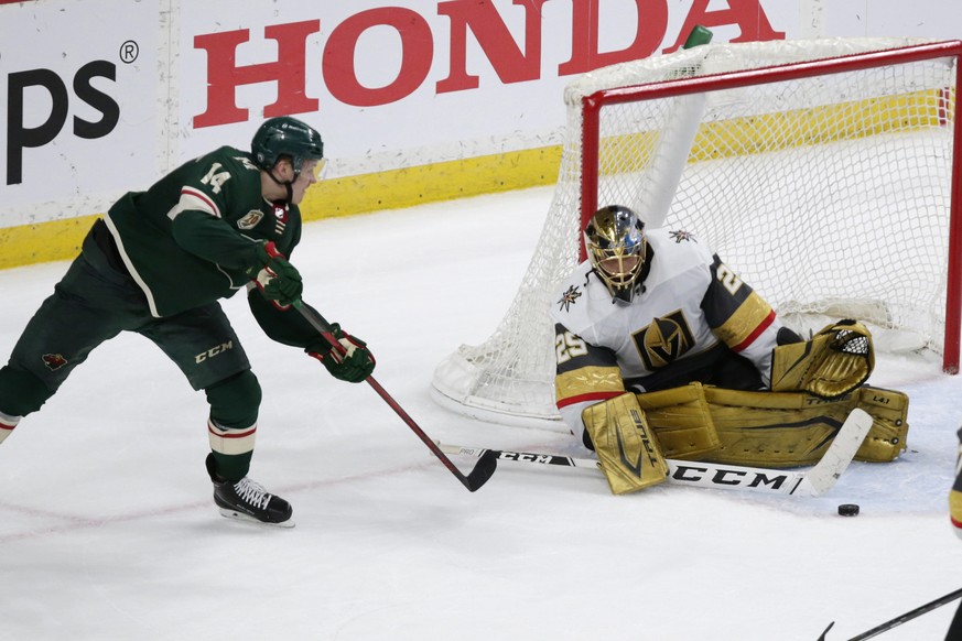 Vegas Golden Knights goaltender Marc-Andre Fleury (29) stops Minnesota Wild center Joel Eriksson Ek (14) during the third period of an NHL hockey game Saturday, May 22, 2021, in St. Paul, Minn. The Go ...