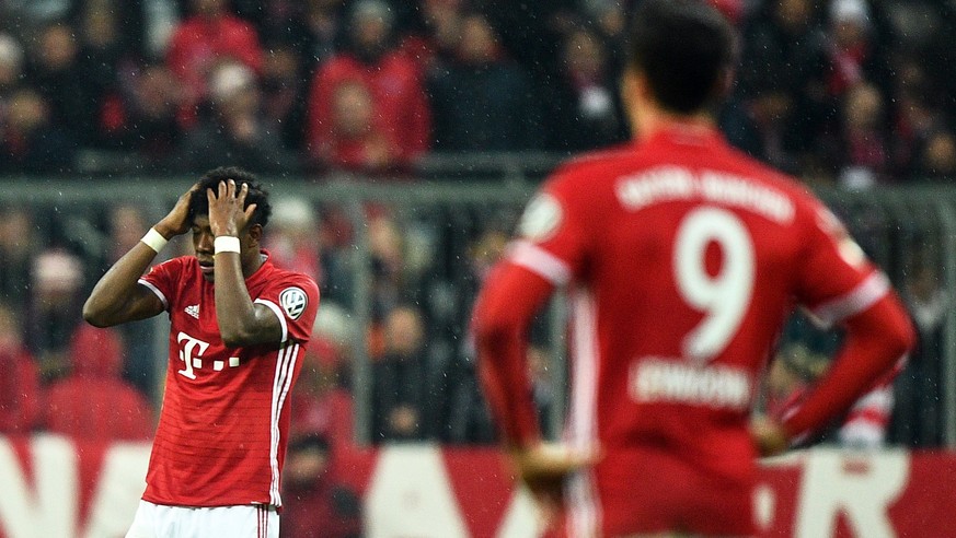 epa05929719 Bayern Munich&#039;s David Alaba (L) reacts after the German DFB Cup semi final soccer match between FC Bayern Munich and Borussia Dortmund in Munich, Bavaria, Germany, 26 April 2017. Dort ...