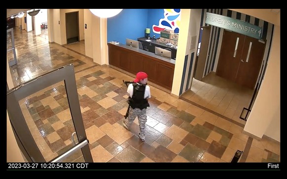 epa10546344 A frame grab from a handout surveillance video released by Metro Nashville Police Department shows alleged shooter they identify as Audrey Elizabeth Hale during the shooting at the Covenan ...