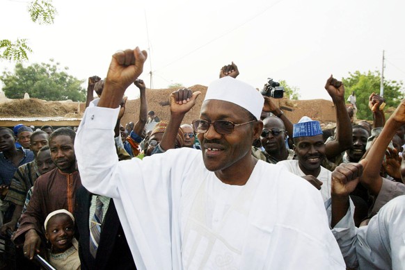 FILE - In this Saturday, April. 19, 2003 file photo, Nigerian Muhammadu Buhari from the opposition party ANPP, All Nigeria People&#039;s Party, acknowledges support after voting in Daura, Nigeria. Nig ...