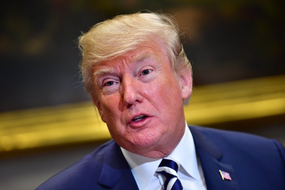 epa06616357 US President Donald J. Trump holds a law enforcement roundtable on sanctuary cities, in the Roosevelt Room at the White House in Washington, DC, USA, 20 March 2018. EPA/KEVIN DIETSCH / POO ...