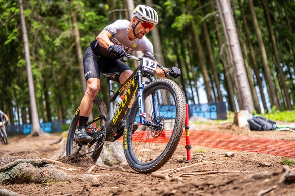 Nino Schurter of Switzerland, 2nd, in action during the Cross Country Men Elite, XCO, WHOOP UCI Mountain Bike World Series, on Sunday, May 26, 2024, in Nove Mesto, Czech Republic. (KEYSTONE/Maxime Sch ...