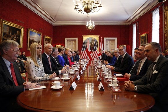 President Donald Trump, left center, and British Prime Minister Theresa May, right center, speak during a business roundtable event at St. James&#039;s Palace, Tuesday, June 4, 2019, in London. (AP Ph ...