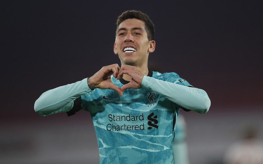 epa09043542 Roberto Firmino of Liverpool celebrates after scoring the 2-0 leading during the English Premier League soccer match between Sheffield United and Liverpool FC in Sheffield, Britain, 28 Feb ...