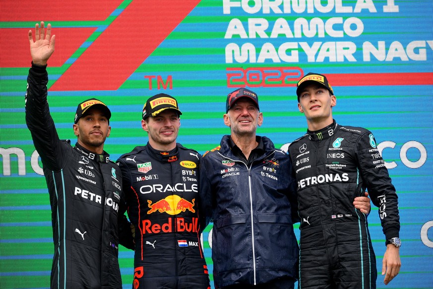 epa10100247 (L-R) Second placed Mercedes driver Lewis Hamilton of Britain, winner Red Bull driver Max Verstappen of the Netherlands, Adrian Newey, chief technical officer of the Red Bull Racing and th ...