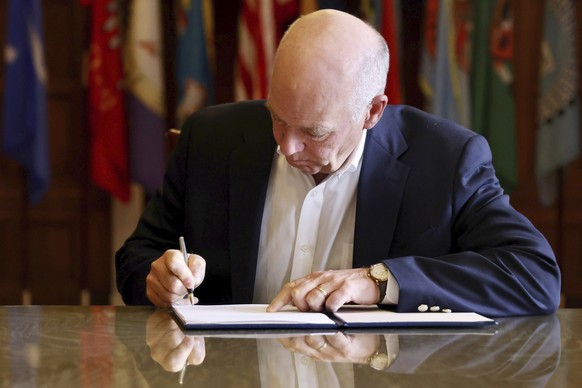 FILE - In this photo provided by the Montana Governor&#039;s Office, Republican Gov. Greg Gianforte signs a law banning TikTok in the state, May 17, 2023, in Helena, Mont. Montana is asking a federal  ...