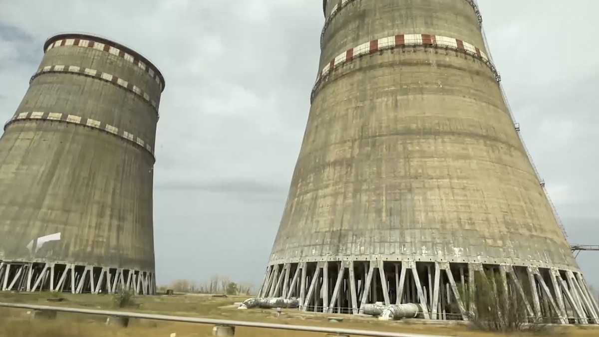 epa11584838 A handout still image taken from handout video provided by the Russian Defence ministry press-service shows damaged cooling system of the Zaporizhzhia Nuclear Power Plant, during a tour by ...