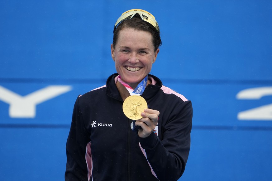 Flora Duffy of Bermuda holds her gold medal during a medal ceremony for the women&#039;s individual triathlon competition at the 2020 Summer Olympics, Tuesday, July 27, 2021, in Tokyo, Japan. (AP Phot ...