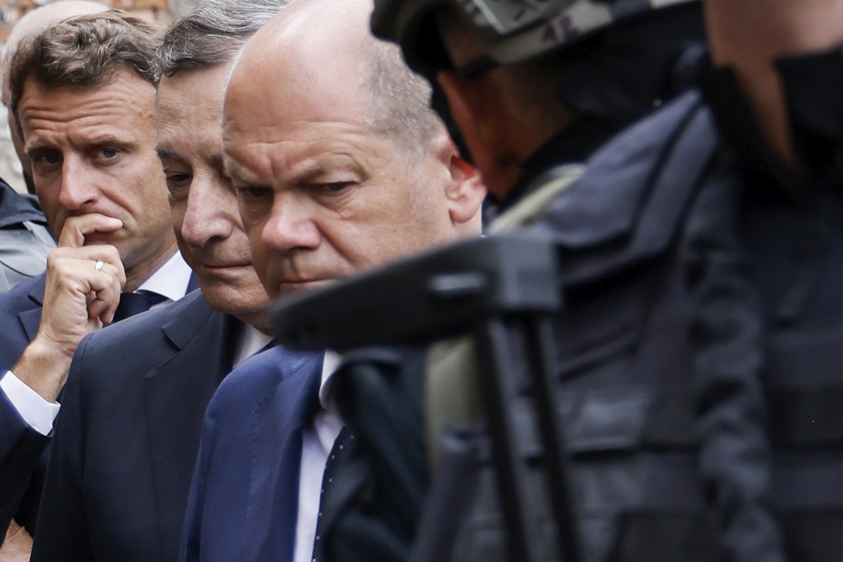 French President Emmanuel Macron, left, Italian Prime Minister Mario Draghi, center, and German Chancellor Olaf Scholz visit Irpin, outside Kyiv, Thursday, June 16, 2022. The leaders of France, German ...