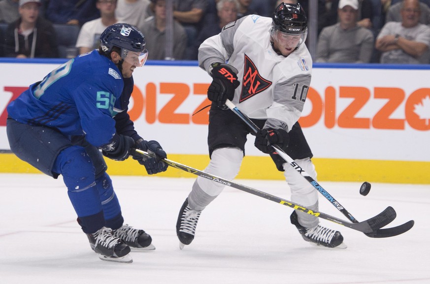 Team Europe&#039;s Roman Josi, left, and Team North America&#039;s J.T. Miller compete for the puck during first period of an exhibition game at the World Cup of Hockey, Thursday, Sept. 8, 2016, in Qu ...