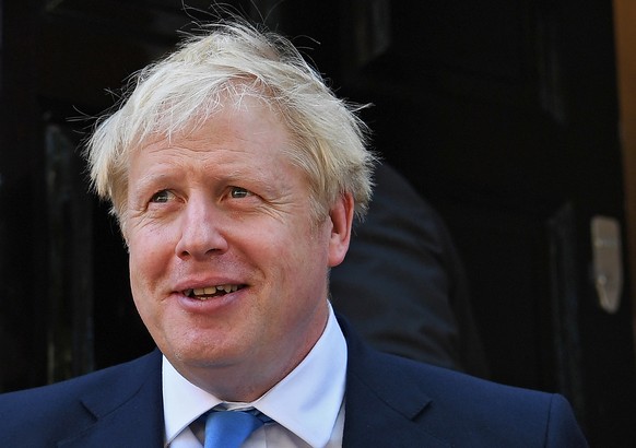 epa07735396 Conservative party leader Boris Johnson departs to his office after he was announced as the new Conservative party leader at an event in London, Britain, 23 July 2019. Former London mayor ...