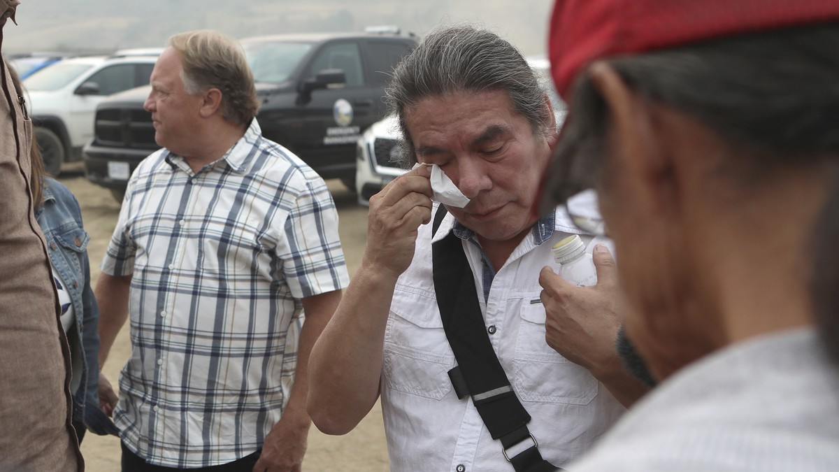 Premier David Eby meets with Chief James Tomma from the Little Shushwap Lake as he talks about evacuating his home as they tour the Tselletkwe Lodge in Kamloops, British Columbia, Tuesday, Aug. 22, 20 ...