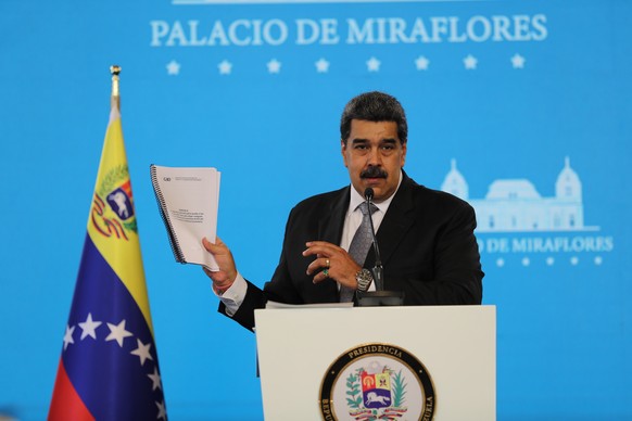 epa09019298 The president of Venezuela, Nicolas Maduro, speaks during a press conference at the Miraflores Palace, in Caracas, Venezuela, 17 February 2021. Maduro said that the immunization of health  ...