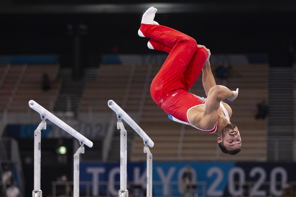 Pablo Braegger of Switzerland performs on the parallel bars during the men&#039;s artistic gymnastics qualification at the 2020 Tokyo Summer Olympics in Tokyo, Japan, on Saturday, July 24, 2021. (KEYS ...