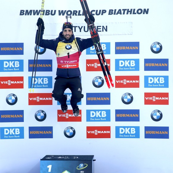 epa06626431 Winner Martin Fourcade of France reacts during the award ceremony of the men 12,5km pursuit race of the IBU Biathlon World Cup in Tyumen, Russia, 24 March 2018. EPA/SERGEI ILNITSKY