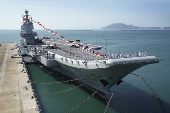 In this photo taken Dec. 17, 2019 and released Dec. 27, 2019 by Xinhua News Agency, the Shandong aircraft carrier is docked at a naval port in Sanya in southern China&#039;s Hainan Province. The commi ...