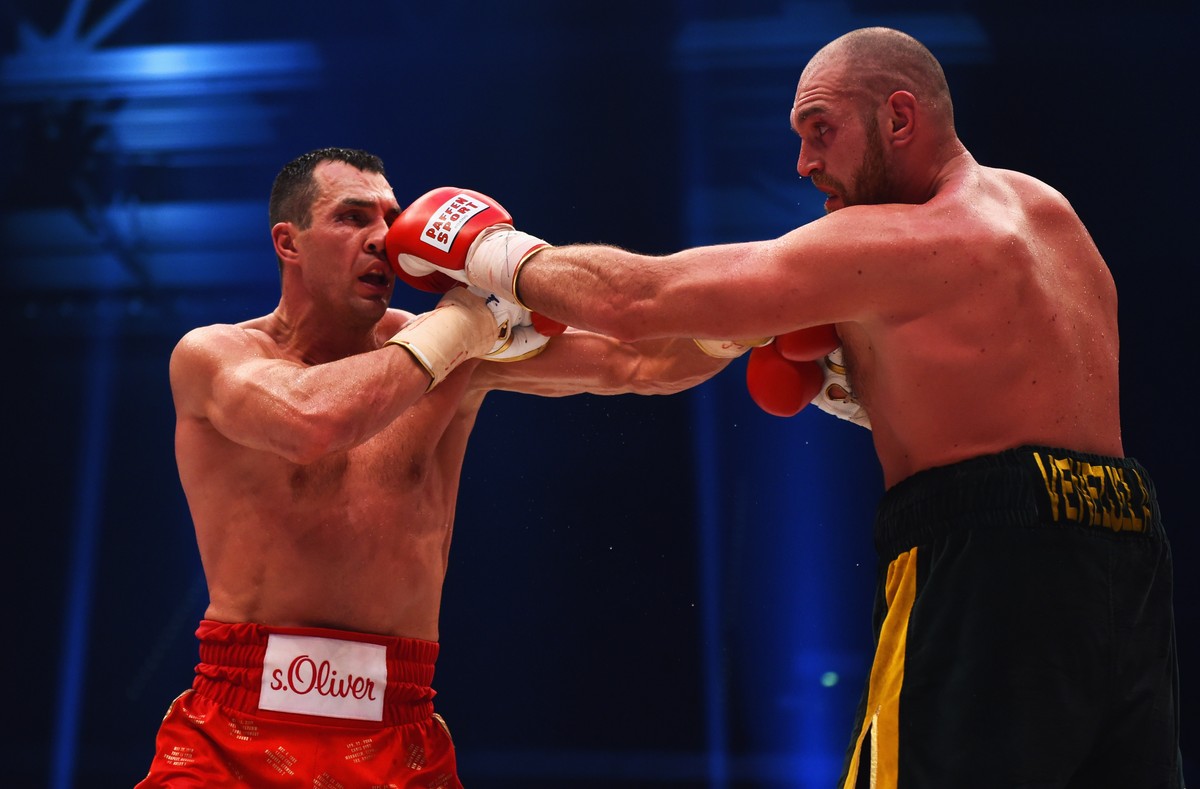 DUESSELDORF, GERMANY - NOVEMBER 28: Tyson Fury in action with Wladimir Klitschko during the IBF IBO WBA WBO Heavyweight World Championship contest at Esprit-Arena on November 28, 2015 in Duesseldorf,  ...