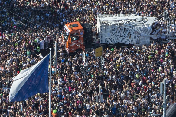 Aerial view of a Lovemobeil and hundreds of thousands of participants dancing through the streets during the 24th Street Parade, an annual dance music parade, in the city center of Zurich, Switzerland ...