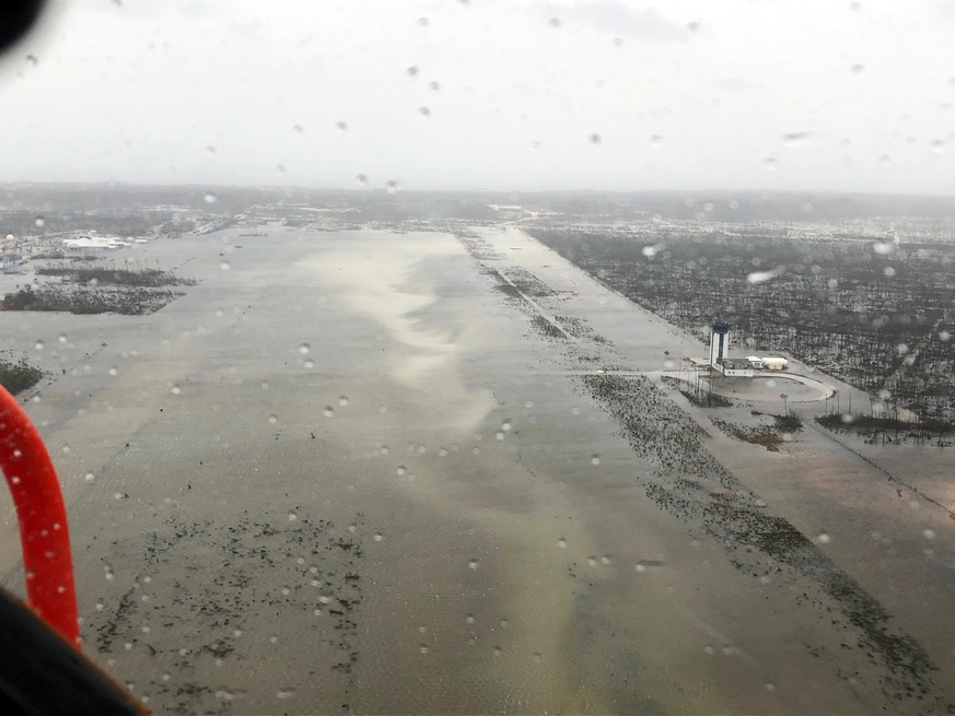 epa07814893 A handout aerial view taken by Coast Guard Air Station Clearwater forward-deployed four MH-60 Jayhawk helicopter crew in support of search and rescue and humanitarian aid in the Bahamas, 0 ...