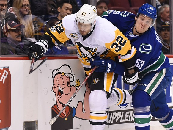 Mar 11, 2017; Vancouver, British Columbia, CAN; Vancouver Canucks forward Bo Horvat (53) checks Pittsburgh Penguins defenseman Mark Streit (32) during the first period at Rogers Arena. Mandatory Credi ...