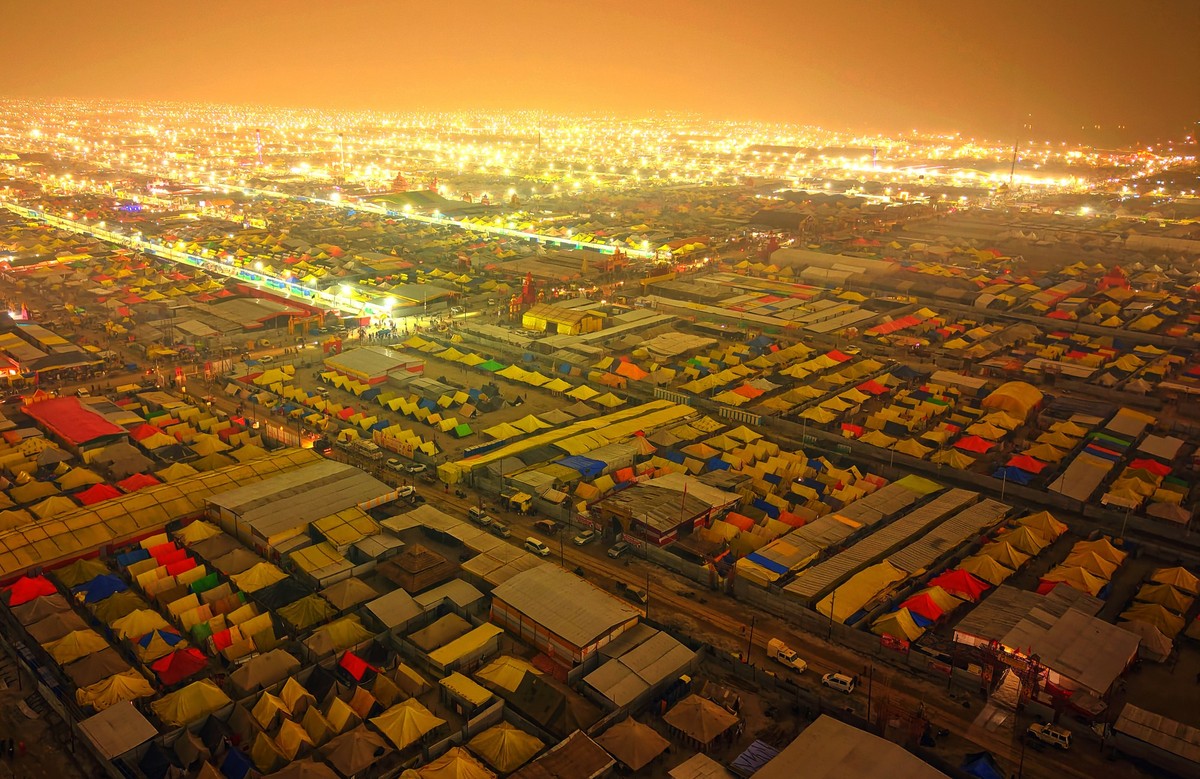 An aerial view shows the temporary camp set up for Hindu devotees at the Sangam, the confluence of the Rivers Ganges, Yamuna, and mythical Saraswati, during the Maha Kumbh Mela festival in Prayagraj,  ...