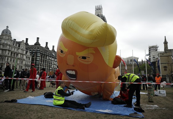 The &#039;Trump Baby&#039; blimp is inflated in Parliament Square in central London as people start to gather to demonstrate against the state visit of President Donald Trump, Tuesday, June 4, 2019. T ...