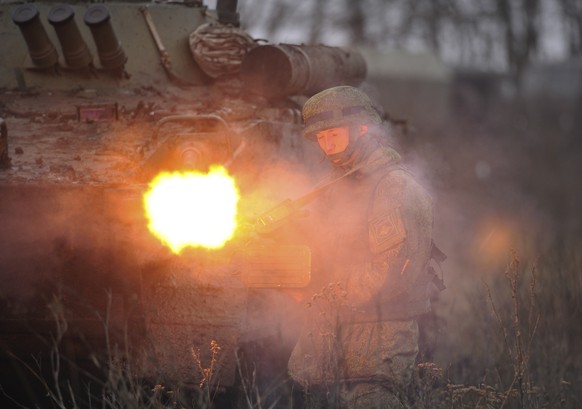 FILE - A Russian army soldier takes part in drills at the Kadamovskiy firing range in the Rostov region in southern Russia, Friday, Dec. 10, 2021. With tens of thousands of Russian troops positioned n ...