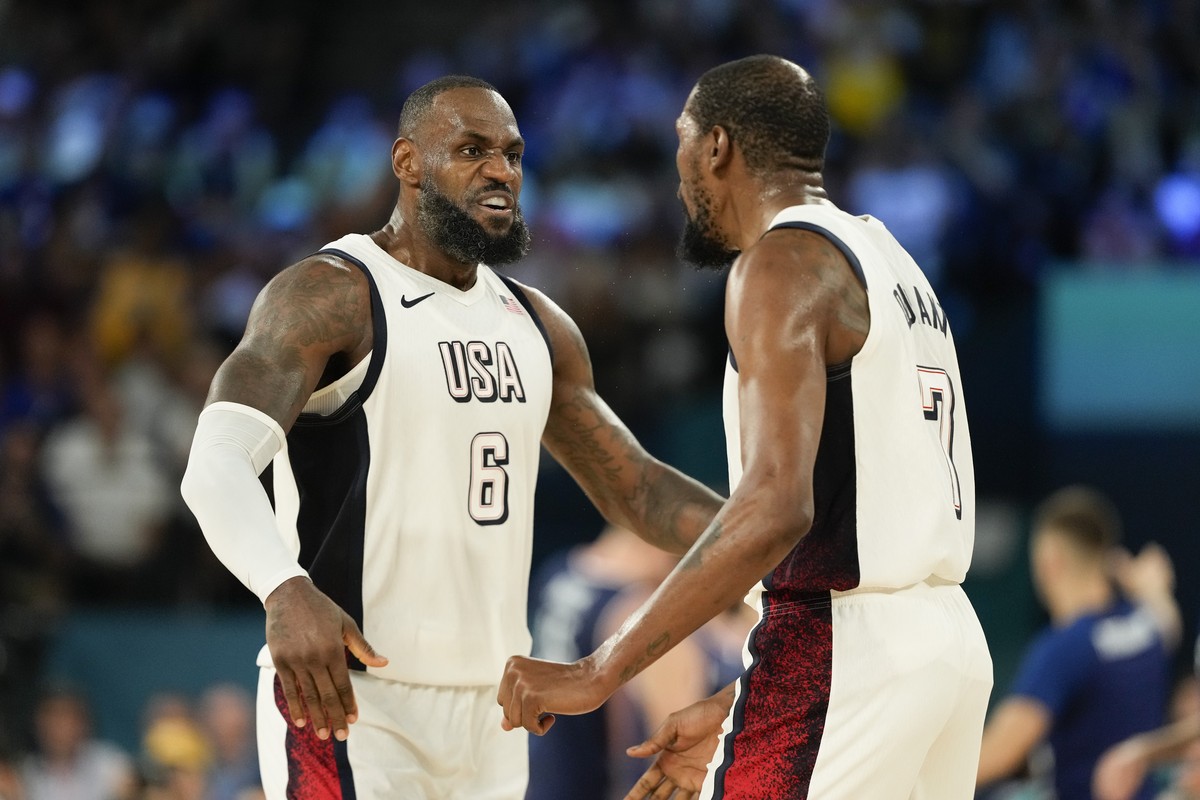 United States' LeBron James (6) and Kevin Durant (7) celebrate a basket against Serbia during a men's semifinals basketball game at Bercy Arena at the 2024 Summer Olympics, Thursday, Aug. 8, ...