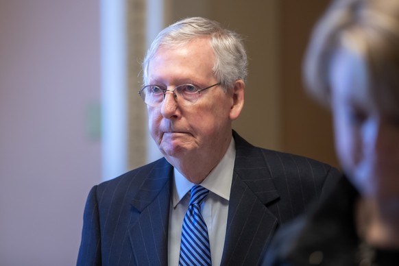 epa08316580 Republican Senate Majority Leader Mitch McConnell leaves the Senate chamber after a procedural vote failed on a 1.8 trillion US dollar coronavirus COVID-19 stimulus package at Capitol Hill ...